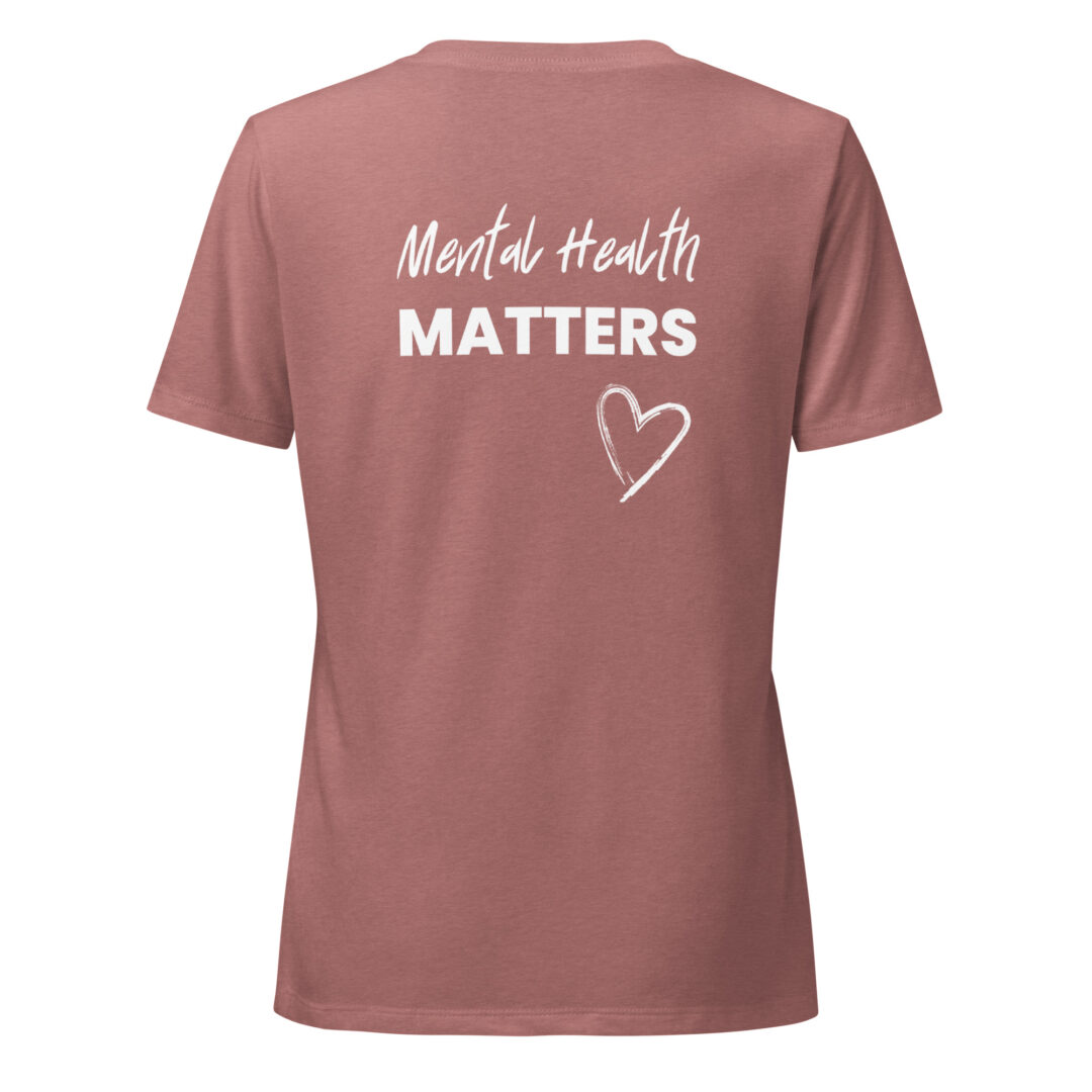 The back of a dusty rose t-shirt printed with the supportive message "Mental Health Matters" and a hand-drawn heart.