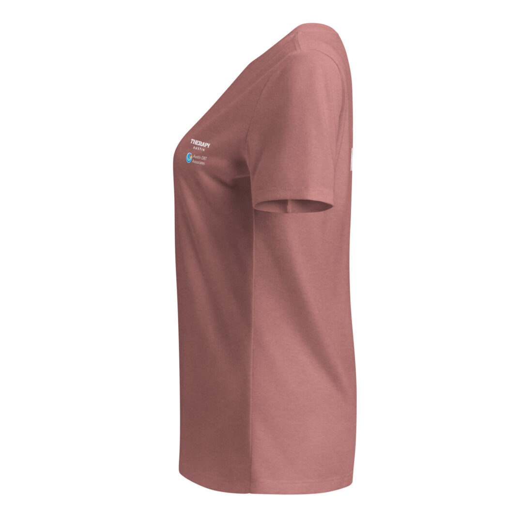 Side view of a dusty rose t-shirt highlighting the Therapy Austin and Austin DBT Associates logos printed on the sleeve.