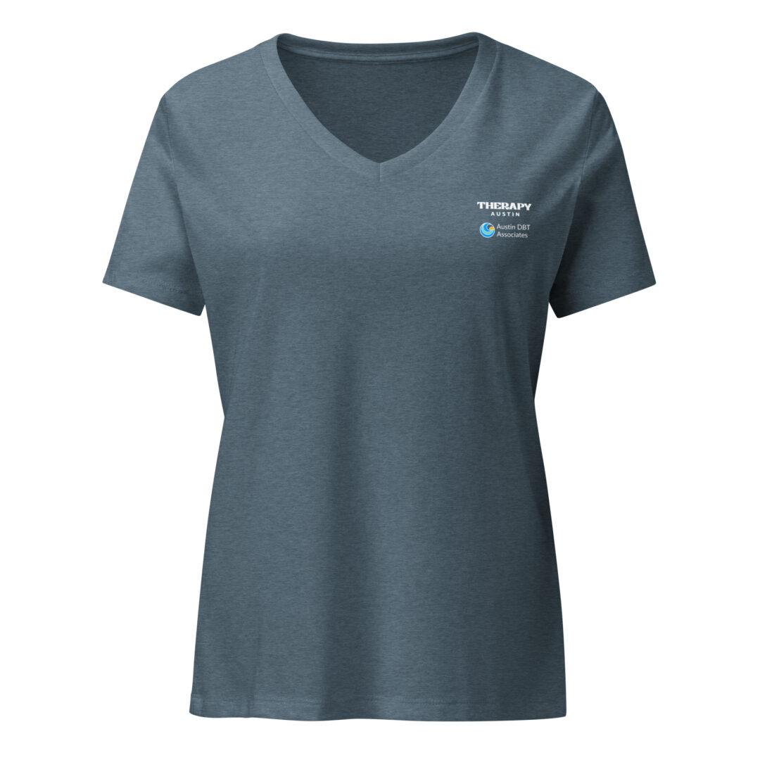 A slate blue v-neck t-shirt with the Therapy Austin and Austin DBT Associates logos printed on the front left chest.